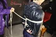 Watching sexy Sonja being tied and gagged from another woman both wearing shiny nylon rainwear (Pics)