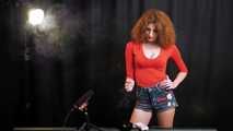 Skinny girl with wild red hair loves smoking a 120mm between the shooting