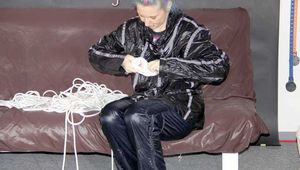 MARA arranges her ropes wearing a really shiny black rain pants and rain jacket (Pics)
