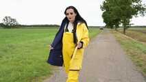 Miss Amira on the road in a Frisian mink, yellow rain dungarees and rubber boots