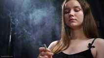 18 aged girl is smoking two 100mm Reds with a lot a nose exhales