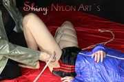 Watching sexy Sonja wearing a sexy shiny nylon shorts and a rain jacket being tied from Miss D with ropes (Pics)