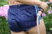 Watching Aiyana wearing only a sexy blue shiny nylon shorts watering the garden (Pics)