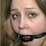 NAKED, BALL-TIED, TAPE AND RING-GAGGED CUTIE FACE HOLLY (D25-10)