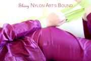 Mara tied and gagged with cloths on a sofa wearing a sexy purple shiny nylon rainwear (Pics)