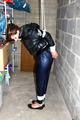 Julia tied and gagged in down jacket (cellar)