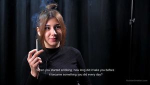 Alina is giving an interview while smoking 100mm cigarette at the smoking studio