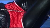 Mara ties and gagges herself with handcuffs wearing shiny nylon shorts over an leggins and a rain jacket (Video)