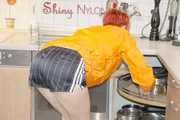 SEXY SONJA during her house work wearing sexy shiny nylon shorts and rain jacket (Pics)