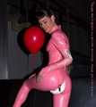 A babypink latex catsuit with Emma and a wet diaper inside