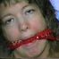 25 YR OLD CHARLENE IS BANDANA CLEAVE, TAPE, HOME MADE TUBE, & HAND GAGGED, MOUTH STUFFED & TIED TO A CHAIR. (D55-8)