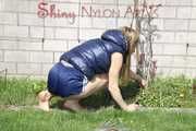 Sexy Sandra wearing a sexy darkblue shiny nylon shorts and a blue downvest during her gardening work Part 2 (Pics)