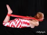 [From archive] Gatiita is mummified topless in red and white tape and hog taped