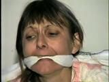 48 Yr OLD WAITRESS IS BALL-GAGGED, CLEAVE & WRAP TAPE GAGGED, BOUND HANDS, WRIST-GAGGED, MOUTH STUFFED & HANDGAGGED (D41-10)