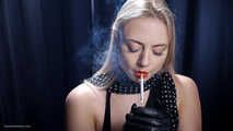 Blonde is smoking in a black leather gloves