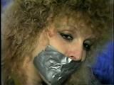 BEAUTIFUL DOE EYED REBECCA IS BALL-GAGGED, MOUTH STUFFED, TAPE GAGGED & BLINDFOLDED (D33-4)