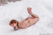 Naked barefoot Greta is tightly bound in snow - Photos