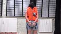 Handcuffed in life jacket