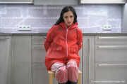 Miss Amira in red nylon rain gear and tranparent rain suit get´s bouind and gagged