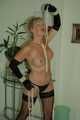 Busty blonde mature Marlen posing topless in gloves and stockings