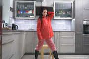 Miss Amira in red nylon rain gear and tranparent rain suit get´s bouind and gagged