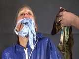 Watch Sandra beeing bound, pantygagged and finally pantyhooded in her shiny nylon Rainwear