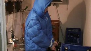 Archive girl tied, gagged and hooded in a cellar wearing a shiny light blue downcoat (Video)