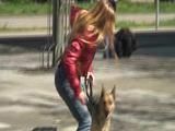 Katharina take a walk with her dog wearing a sexy red shiny down jacket (Video)