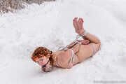 Naked barefoot Greta is tightly bound in snow - Photos