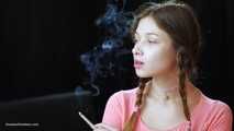 Watch the beauty with crystal blue eyes smoking a 120mm cigarette in her fresh video