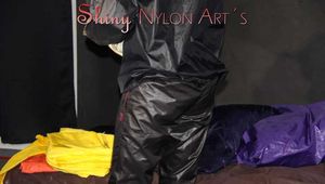 Watching sexy Sandra wearing sexy shiny nylon rainwear preparing the bed and the studio and changing rainwear (Pics)