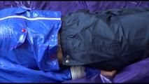 Samantha tied and gagged on bed wearing a shiny darkblue nylon rain pants and a light blue rain jacket (Video)