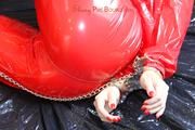 Sophie ties and gagges herself in a shiny red PVC saunasuit (PICS)