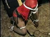 BLACK SHONDA IS RUBBER BAND BALL-GAGGED, MOUTH STUFFED, CLEAVE GAGGED & TIED BACKWARDS ON A CHAIR (D36-15)