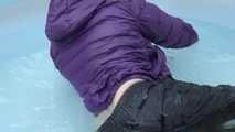 Watching sexy Sonja wearing a sexy shiny nylon rain pant and a purple down jacket enjoying the water in the swimming pool (Video)