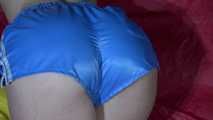 Watching sexy Sonja wearing ONLY a sexy lightblue shiny nylon shorts lolling on the bed (Video)
