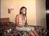 18 Yr OLD BLACK COLLEGE STUDENT IS MOUTH STUFFED, CLEAVE GAGGED, CHAIR TIED, SELF TYING & GAGGING WITH TAPE AND HANDCUFFS WHILE WEARING TORN BLUE JEANS AND BAREFOOT & TOE TIED (D64-10)