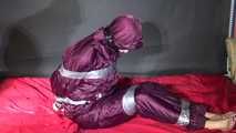 Pia being tied and gagged with tape on a sofa wearing sexy purple shiny nylon downwear (video)