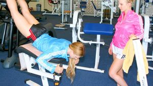 Katharina and Jenny during their workout in the fitness center wearing sexy shiny nylon shorts and rain jackets (Pics)