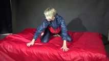 Watching Sonja wearing supersexy red/blue shiny nylon rainwear preparing her bed with shiny nylon cloth (Video)