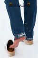 Linda with white clogs in the snow