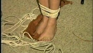 29 Yr OLD SEXY ROMANIAN TAPES AND CLEAVE GAGS HERSELF, HOPS AROUND THE ROOM BAREFOOT & IS CLEAVE GAGGED 3 MORE TIMES (D53-12)