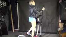 Watching sexy SONJA wearing a sexy blue shiny nylon shorts and a rainjacket during her workout on the hometrainer (Video)