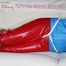 SEXY SANDRA being tied and gagged with ropes and a ballgag on a sofa wearing a SUPERSHINY NEW RED NYLON PANTS and a rain jacket (Pics)