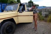 Nude posing at a Jeep