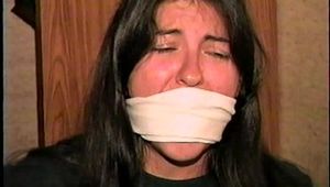 FIRST GRADE LATINA SCHOOL TEACHER  IS TAKEN HOSTAGE OTM GAGGED, MOUTH STUFFED, LEATHER GLOVE HANDGAGGED, & CLEAVE GAGGED PT 2 (D63-11)
