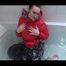 Jil wearing a sexy black down pants and a red down jacket taking a bath (Video)