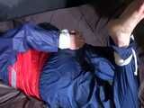 Watch Sonja beeing bound and gagged in shiny nylon Rainwear