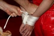 Isabelle tied and gagged in shiny nylon clothes