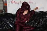 Watching Lucy wearing a supersexy purple/red downsuit preparing her sofa and lolling on it (Pics)